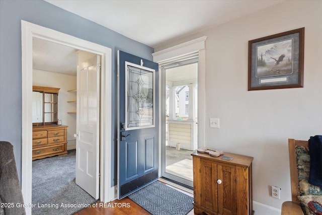 entrance foyer with carpet