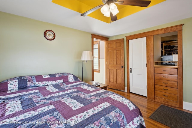 bedroom with ceiling fan and wood finished floors