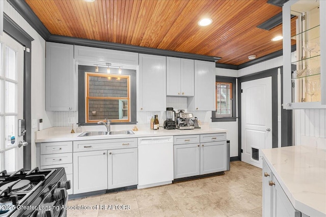 kitchen featuring wooden ceiling, gas range, white dishwasher, and a sink