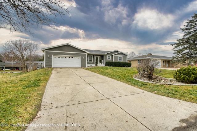 ranch-style house featuring a garage, a front lawn, and concrete driveway