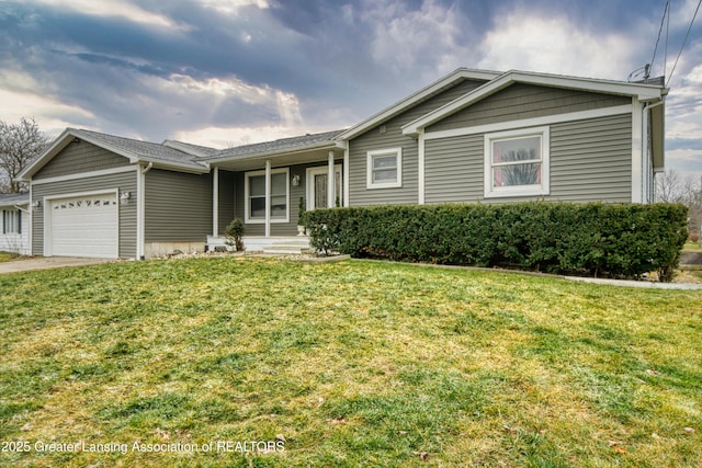 ranch-style home with a front yard, driveway, and an attached garage