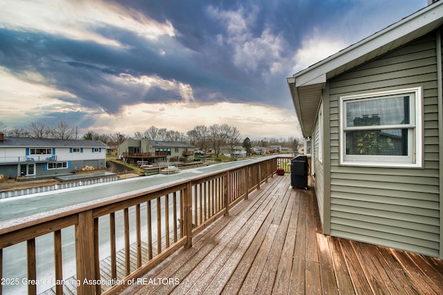 wooden terrace featuring a residential view