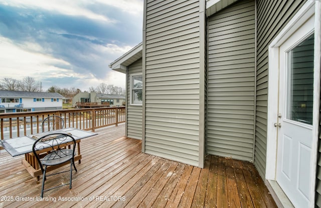 wooden deck with a residential view