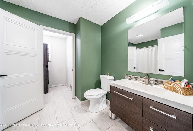 full bathroom with toilet, decorative backsplash, vanity, a textured ceiling, and baseboards