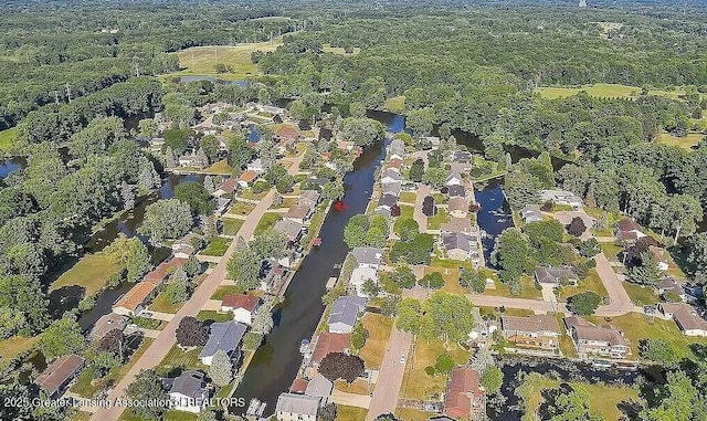 drone / aerial view with a water view and a residential view