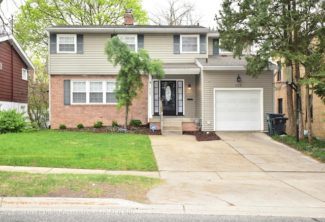 603 N Harrison Rd, East Lansing, MI 48823 - traditional-style home with an attached garage, brick siding, a front yard, a chimney, and driveway