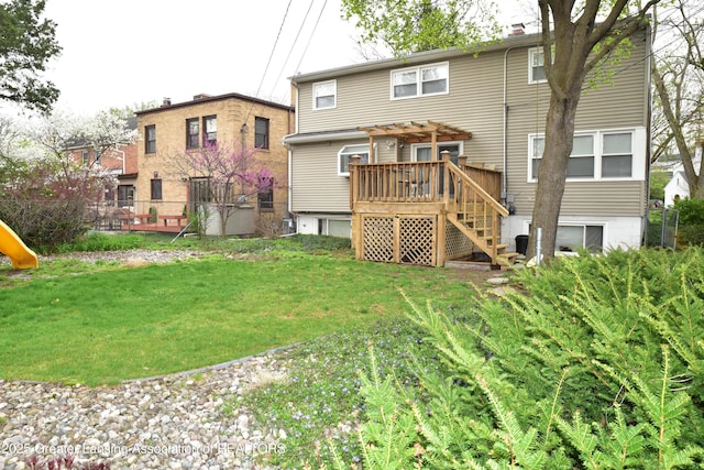 603 N Harrison Rd, East Lansing, MI 48823 - back of property featuring a yard, a pergola, stairway, and a wooden deck