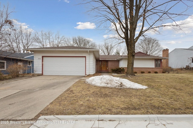 view of front facade featuring concrete driveway, brick siding, an attached garage, and a front yard