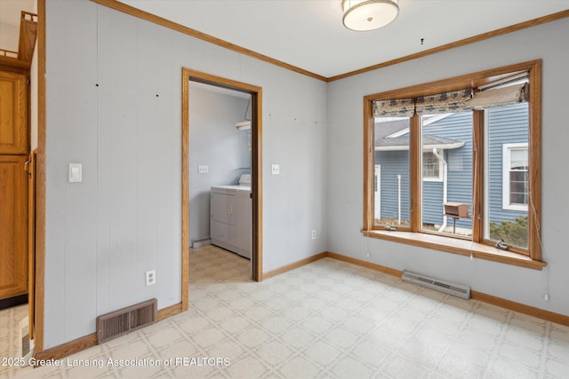 unfurnished room featuring ornamental molding, washer / clothes dryer, visible vents, and light floors