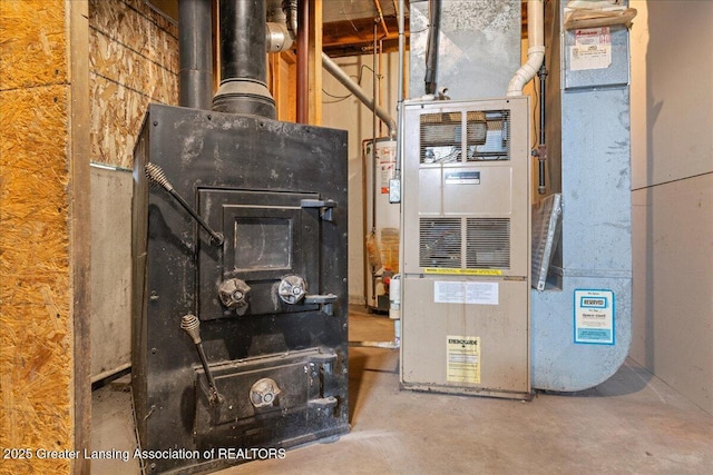 utility room featuring heating unit