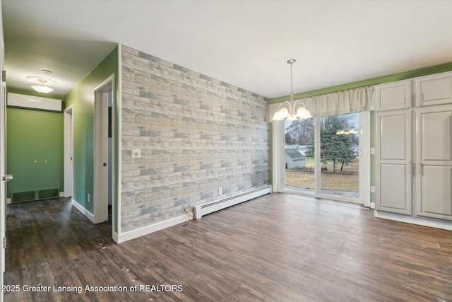 unfurnished dining area with visible vents, baseboards, dark wood finished floors, baseboard heating, and a notable chandelier