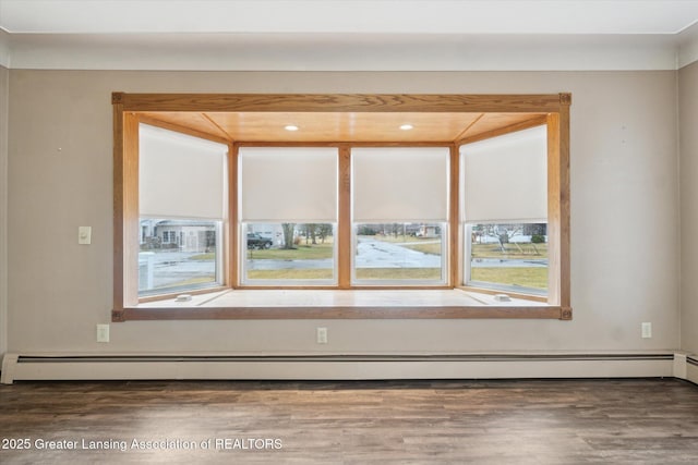 spare room featuring wood finished floors