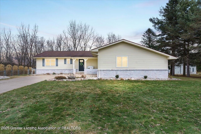 single story home featuring a front lawn and brick siding