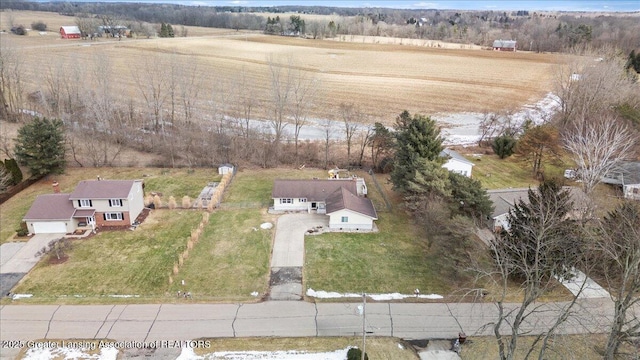 birds eye view of property with a rural view