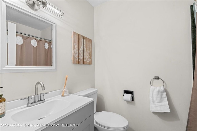 bathroom featuring vanity and toilet