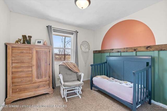 carpeted bedroom with baseboards