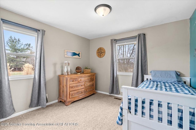 bedroom with visible vents, baseboards, and carpet flooring