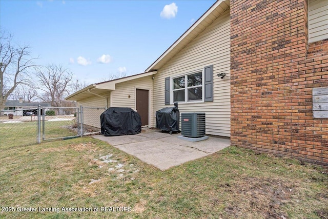 view of patio with a grill, a gate, central AC, and fence