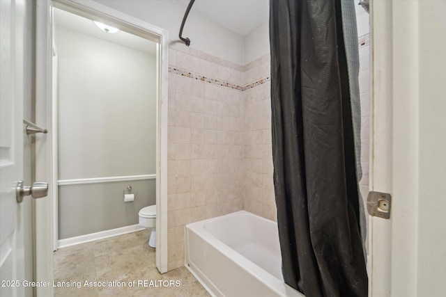 full bath featuring shower / tub combo, baseboards, tile patterned flooring, and toilet