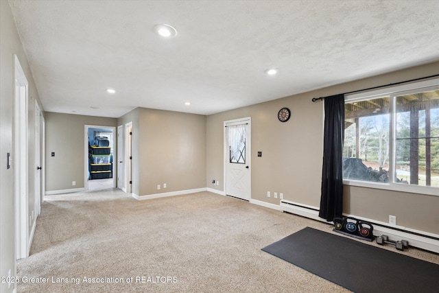 exercise room featuring recessed lighting, carpet flooring, and baseboards