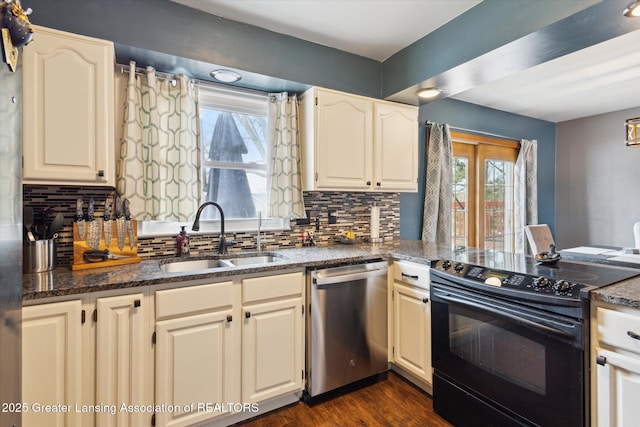 kitchen featuring dark wood-style flooring, a sink, black electric range, stainless steel dishwasher, and tasteful backsplash