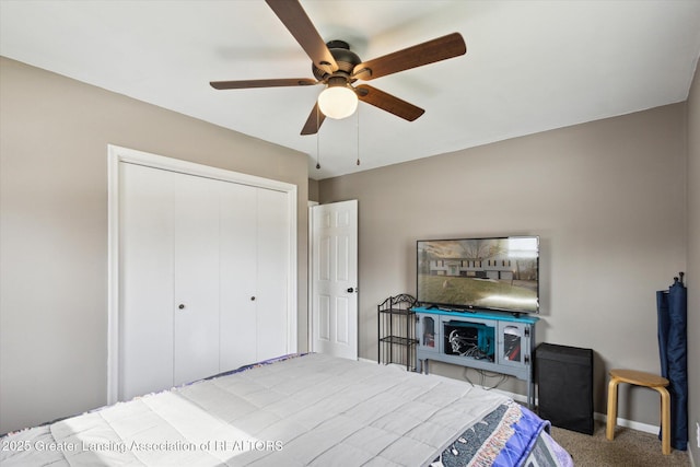 bedroom featuring a closet, carpet flooring, ceiling fan, and baseboards