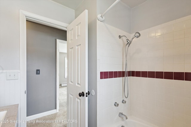 full bathroom featuring baseboards, a baseboard heating unit, and shower / bathing tub combination