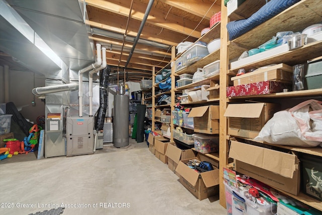 storage room with heating unit and water heater