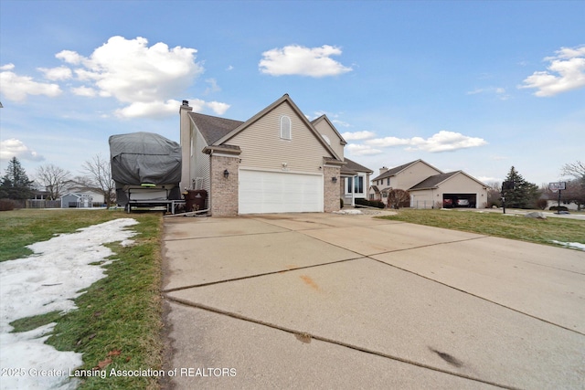 view of front of home with a garage, concrete driveway, brick siding, and a chimney