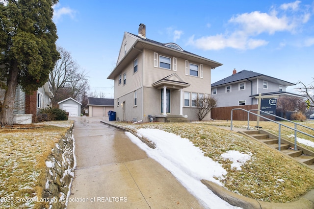 view of front of house with a detached garage, a chimney, stucco siding, fence, and an outdoor structure