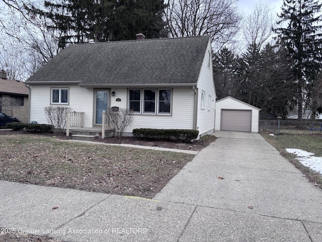 view of front of property with an outdoor structure, fence, a detached garage, concrete driveway, and roof with shingles