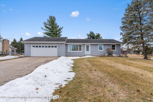 single story home featuring concrete driveway, a front lawn, and an attached garage