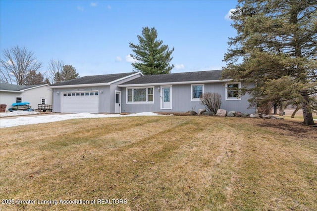 ranch-style home with a garage, a front yard, and driveway