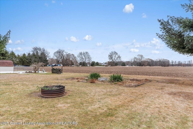 view of yard with a rural view