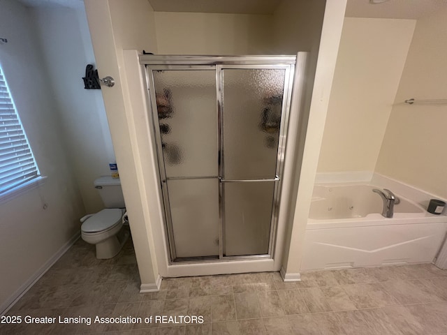 bathroom with baseboards, toilet, a tub with jets, and a shower stall