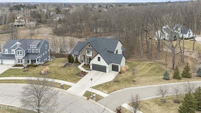 birds eye view of property with a residential view