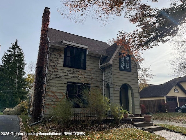 view of front facade featuring a chimney