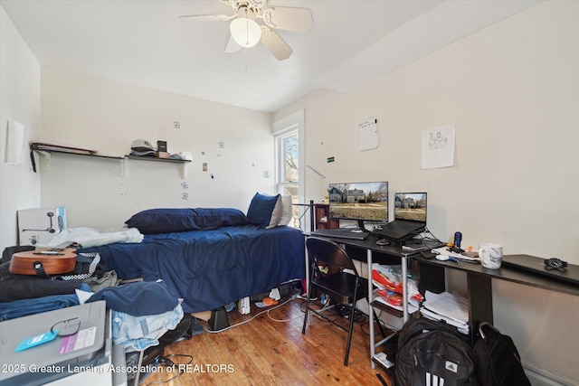 bedroom with wood finished floors and a ceiling fan