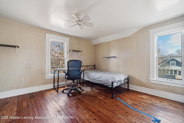 bedroom featuring hardwood / wood-style flooring, baseboards, and a ceiling fan