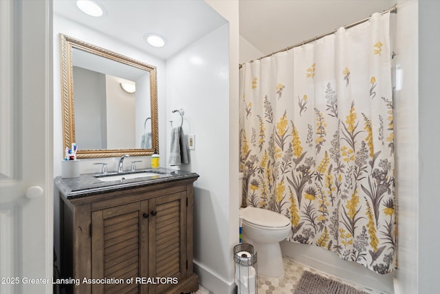 full bath featuring toilet and vanity