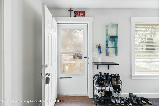 doorway to outside with wood finished floors