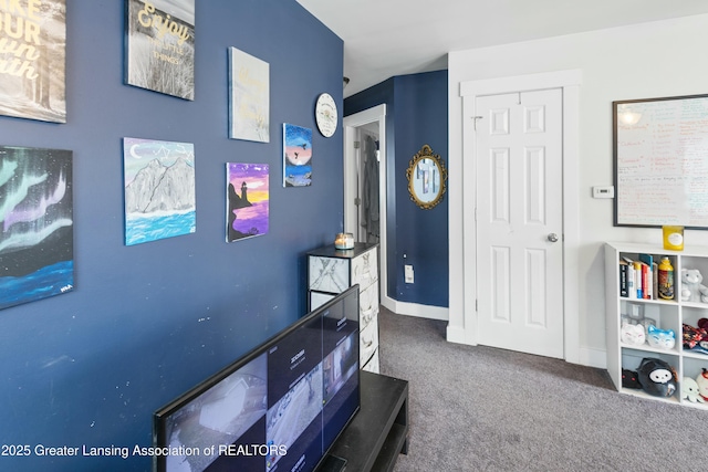 bedroom featuring carpet and baseboards