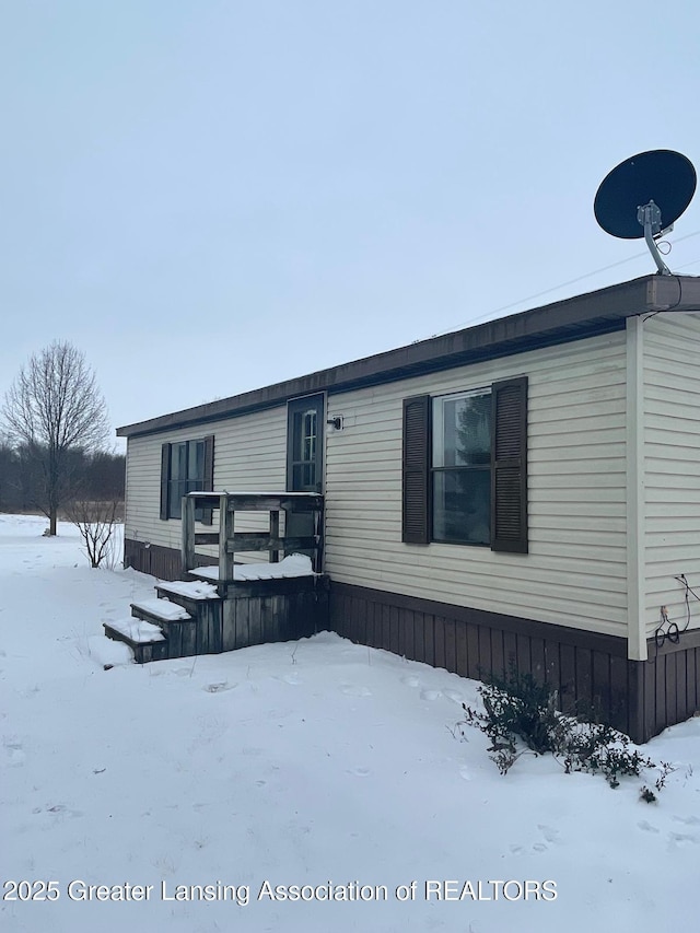 view of front of house featuring a wooden deck