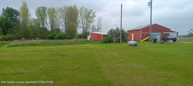 11173 W Bennett Rd, Sumner, MI 48889 - view of grassy yard featuring an outbuilding