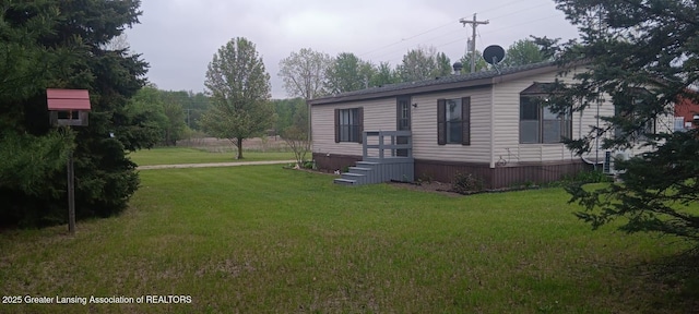 11173 W Bennett Rd, Sumner, MI 48889 - view of front of house with a front lawn