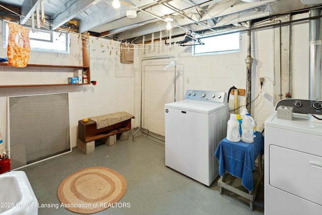 washroom featuring laundry area and separate washer and dryer