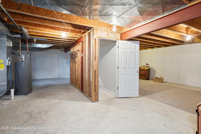 unfinished basement featuring water heater