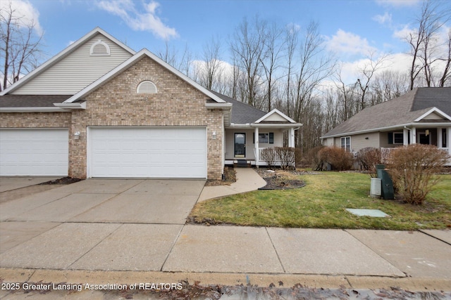 view of front of house featuring a garage, brick siding, concrete driveway, a porch, and a front yard