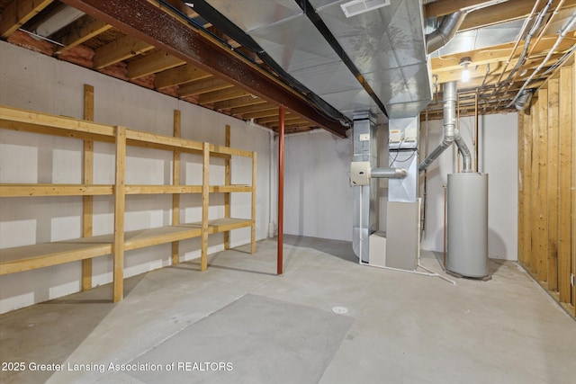 unfinished basement featuring heating unit, visible vents, and gas water heater