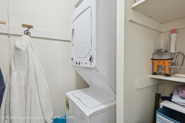 laundry area with stacked washing maching and dryer and laundry area